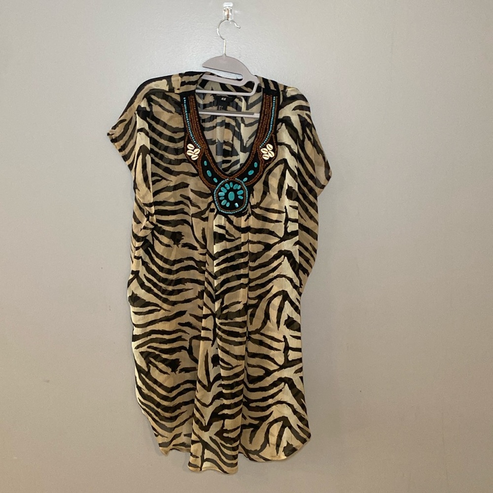 H&M women tunic with beading
Size: 4; leopard print